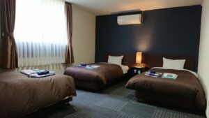 Tre letti singoli in una camera