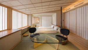 榻榻米客房，配有矮床和玻璃桌