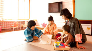 Woman and children sitting on tatami floor