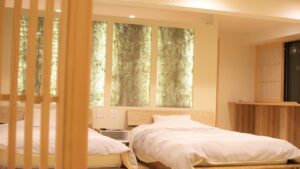 Twin beds in a softly lit guest room