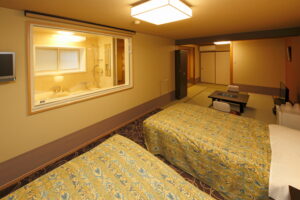 Twin beds in a tatami guest room