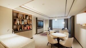 Zona de estar de la habitación con mesa, sillas y sillones