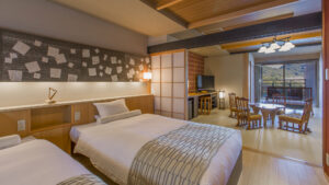 Twin beds in guest room with balcony seating