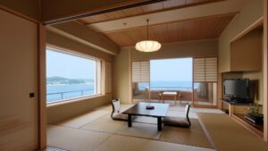 Habitación de tatami con mesa baja y vistas al océano
