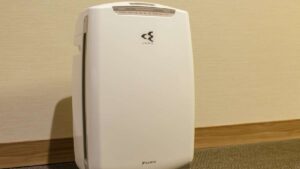 Air purifier against the wall in the room