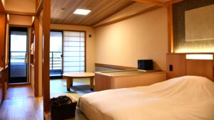Bedroom with low bed and tatami seating area