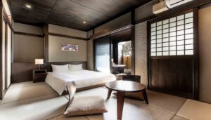 Bed in tatami room with low table and cushion