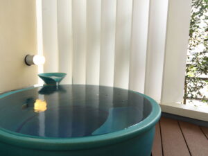 Private round bath beside a window