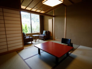 Tatami room with low table and two chairs