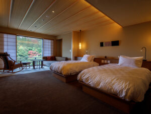 Two beds in a ryokan room with window seating
