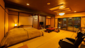 Beds and tatami seating area in a Japanese-style room