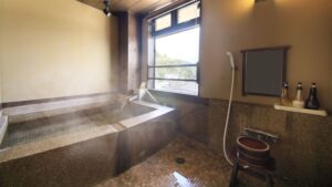 Private stone bath beside a window in the room