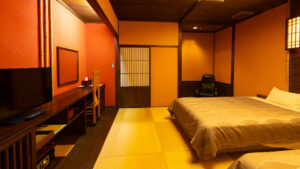 Tatami guest room with two beds and television