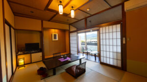 Tatami room with low table and chairs by window