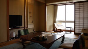 Tatami room with low table and chairs by window