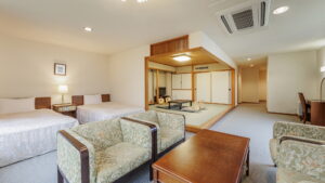 Guest room with twin beds and tatami seating area