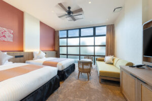 Twin beds and sofa in guest room