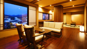 Japanese-style guest room with sofa, chairs, and low table