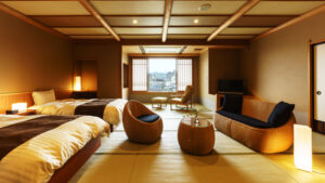 Japanese-style guest room with twin beds and seating area
