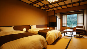 Twin beds in tatami room with window seating area