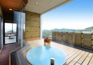 Private open-air bath on a balcony with mountain view