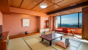 Tatami room with low table, floor cushions, and sofa