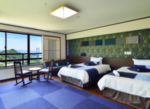 Twin beds in a guest room with window seating