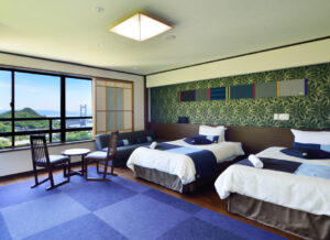 Twin beds in a guest room with window view