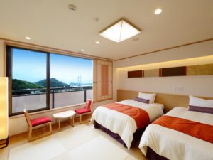 Twin beds in a guest room with window view