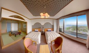 Twin beds in guest room with tatami sitting area
