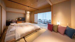 Tatami room with low beds and cushioned bench