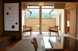 Tatami room with two chairs by an open balcony.
