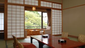 Tatami room with low table and chairs by window