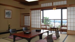 Tatami room with low table and chairs by window