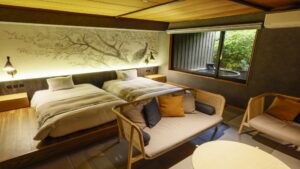 Twin beds and seating area in a guest room