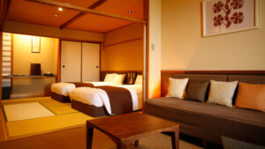 Japanese-style room with twin beds and sofa seating