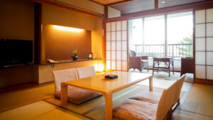 Tatami room with low table and chairs by balcony