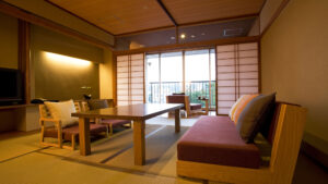 Tatami room with low table, chairs, and bench seating