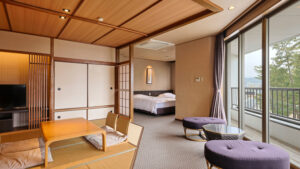Tatami seating area with low table beside bedroom and balcony