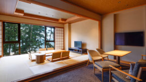 Tatami seating area with table, chairs, and window view