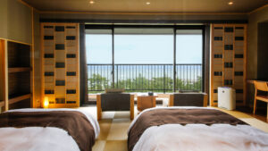 Twin beds in a tatami room facing the balcony