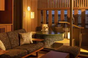 Open-air bath beside sofa seating in guest room