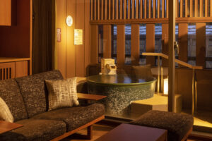 Private round bath beside seating area in guest room