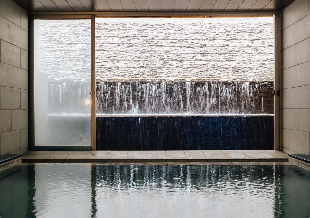 Atami Fuga Indoor Onsen Waterfall View