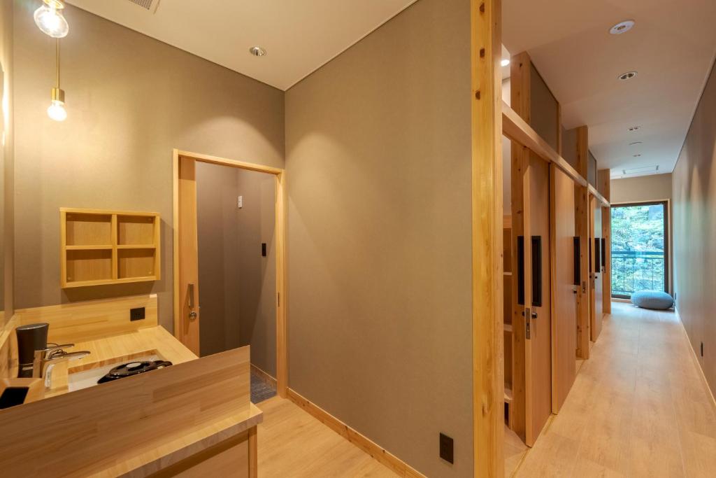 Hishino Onsen Tokiwakan Modern Room Corridor