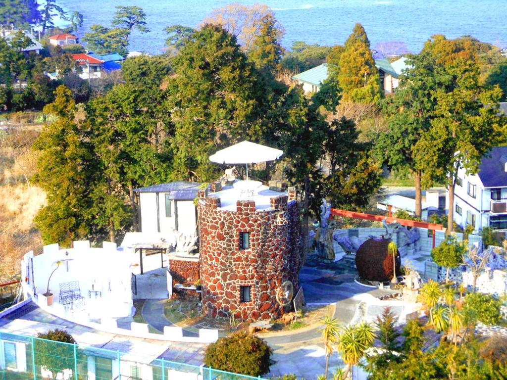 J Garden Ryokan Stone Tower Exterior