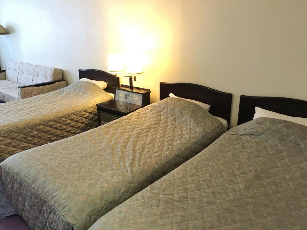 Nikko Astraea Hotel Triple Bedroom