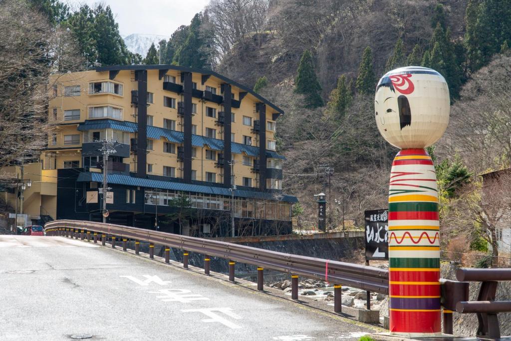 Yumori Onsen Hostel Exterior Kokeshi Statue