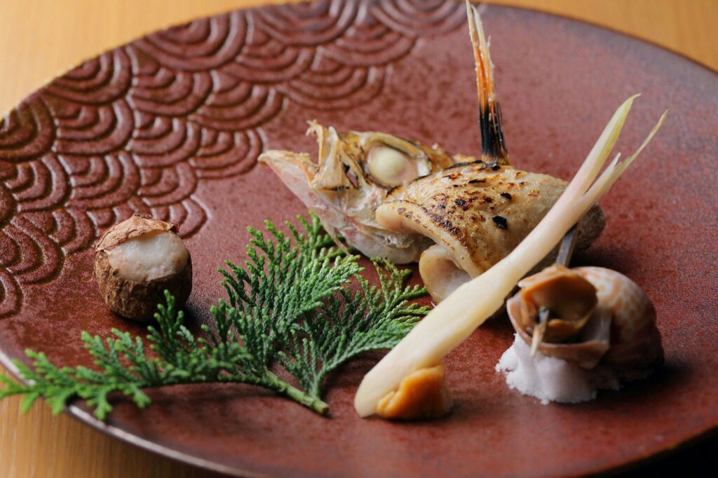 Grilled Fish Dish On A Red Plate