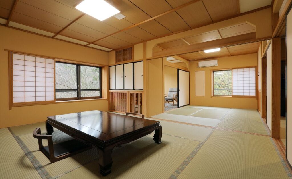 Tatami Room With Low Table And Adjoining Room